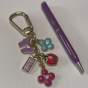 Coach Gold Bag Clip/Keychain with Purple and Red Charms and Coach Pen